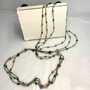 Long beaded necklaces. Three multicolored necklaces.
